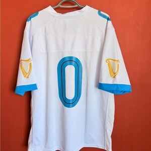 Guinness White Jersey with Blue Accents and Gold Harp Logos